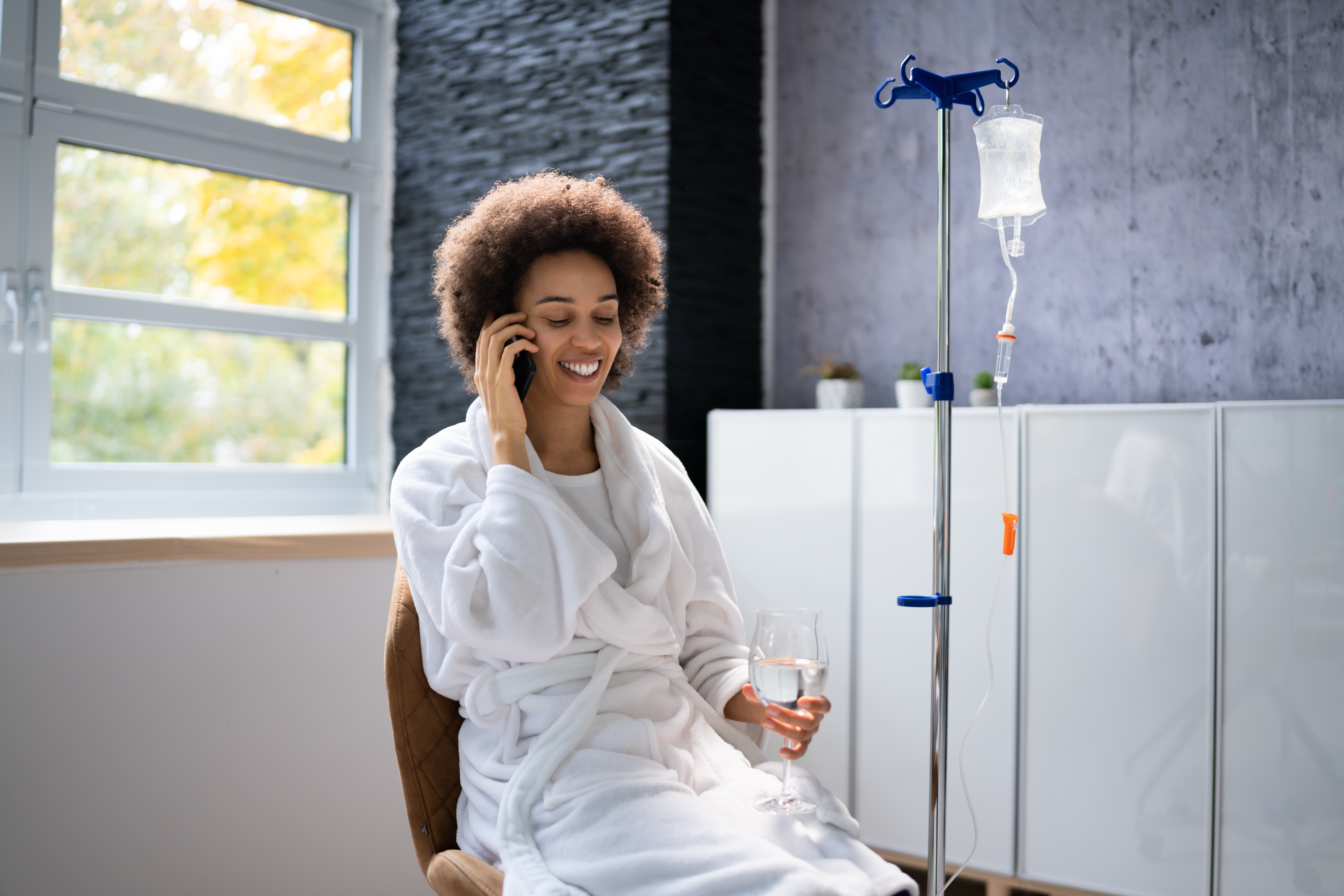 An African American woman getting iv therapy